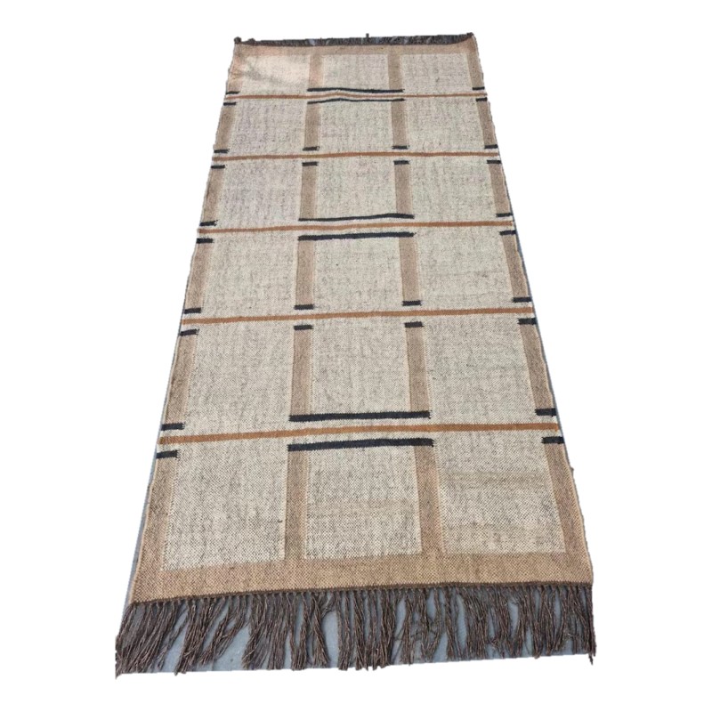 Handwoven wool and jute kilim rug in cream and tan with black and rust stripes and fringed ends