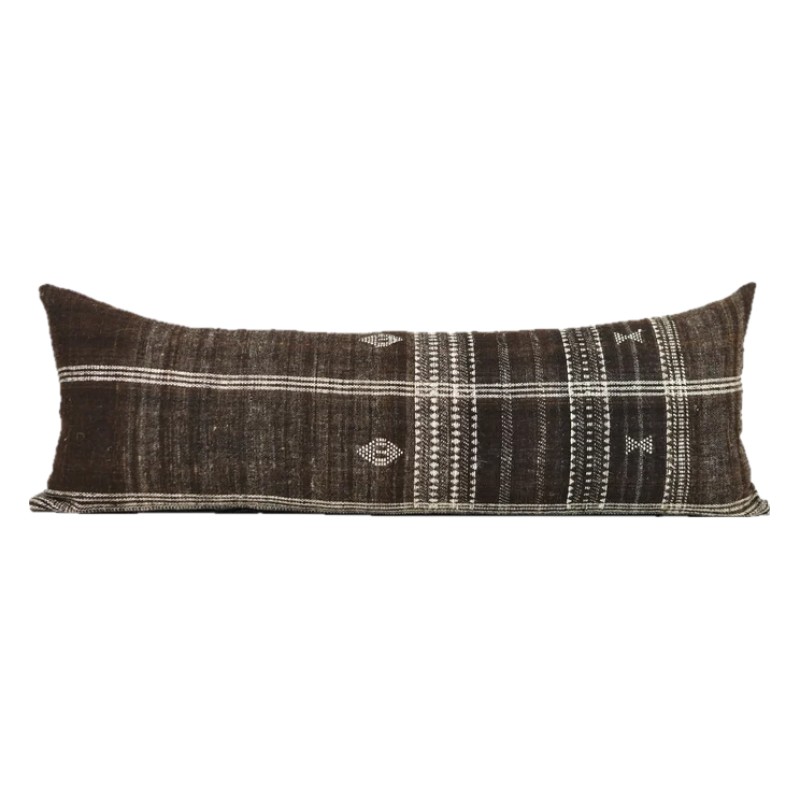 Long handwoven brown wool lumbar pillow with cream stripes and small woven motifs